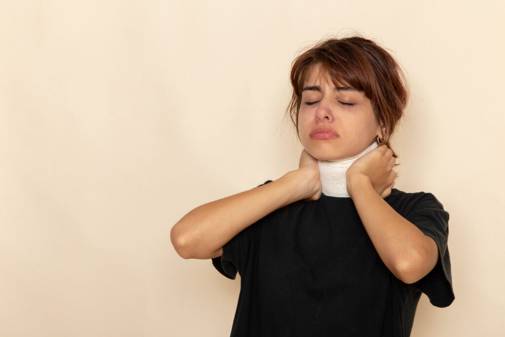 front view sick young female with high temperature covering her throat feeling ill white desk